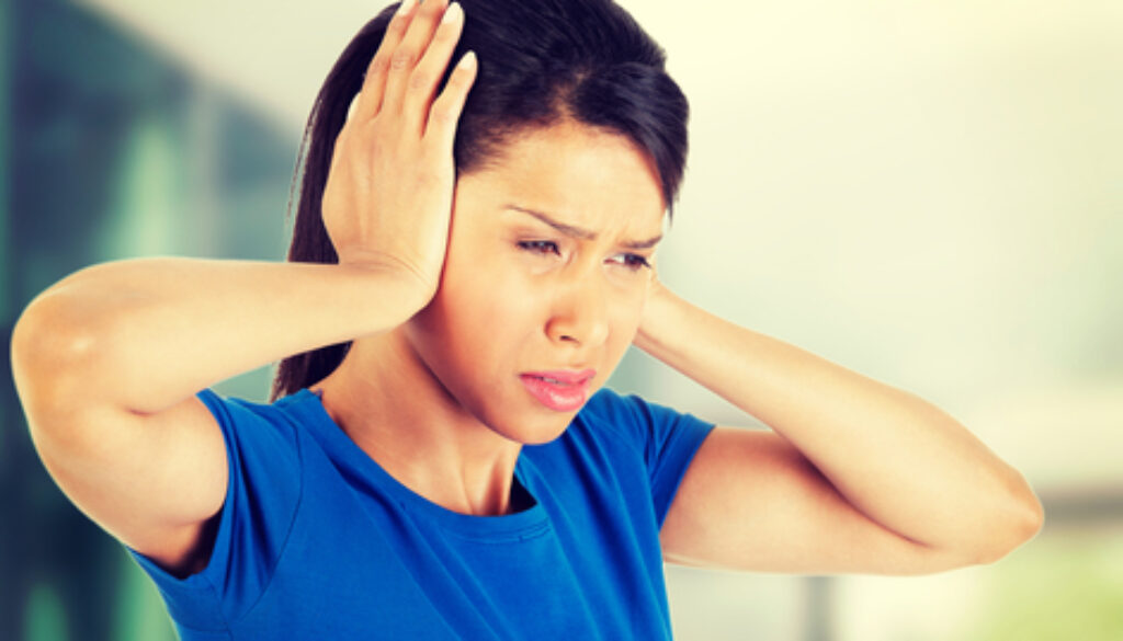 Young woman with huge head ache