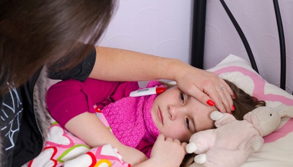 Mother taking care about sick sleeping daughter